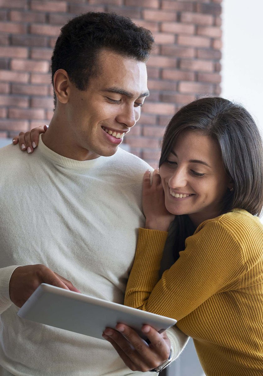 lovely-couple-looking-tablet-opt